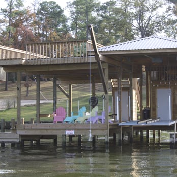 Moseley Construction - Typical One and half boathouse with metal roof and upper sundeck - General Contractors Near Me - Livingston, Texas Moseley Construction - Typical One and half boathouse with metal roof and upper sundeck - General Contractors Near Me - Livingston, Texas