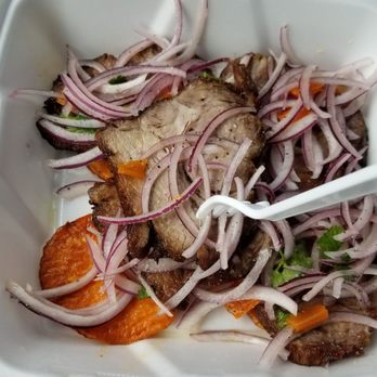 Don Juan V's Sandwiches - Chicharrones appetizer has sweet potatoes under the pork - Peruvian Near Me - Indianapolis, Indiana