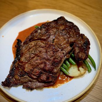 Celeste - BRANDT FARM 14 OZ RIBEYE: crispy potatoes, onion jam, bravas sauce, haricot vert - Desserts Near Me - Narragansett, Rhode Island