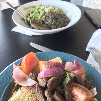Ceviche 19 - Overly salt lomo saltado with uncooked onion and tomato and tallarines verde. - Peruvian Near Me - Anaheim, California