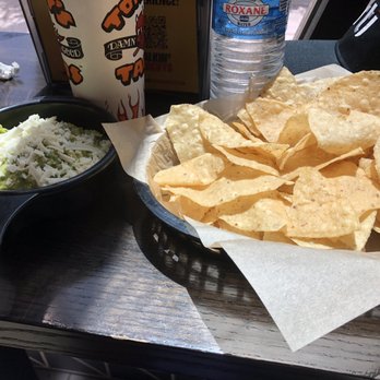 Torchy's Tacos - Chips and guacamole! The Guacamole is on the spicy side. - Tacos Near Me - Austin, Texas Torchy's Tacos - Chips and guacamole! The Guacamole is on the spicy side. - Tacos Near Me - Austin, Texas