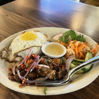 Ba Bar - Spicy Pork Belly flavored with lemongrass and chili, with broken rice and egg on top - Vietnamese Near Me - Seattle, Washington Ba Bar - Spicy Pork Belly flavored with lemongrass and chili, with broken rice and egg on top - Vietnamese Near Me - Seattle, Washington