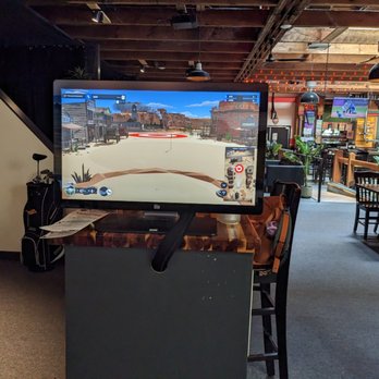 Stadium Golf - a video game being played in a restaurant - Golf Near Me - Tacoma, Washington Stadium Golf - a video game being played in a restaurant - Golf Near Me - Tacoma, Washington