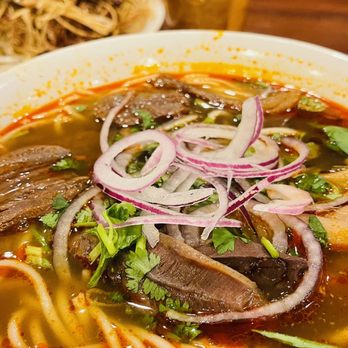 Phuong Nam Restaurant - a bowl of soup with meat and onions - Vietnamese Near Me - Garland, Texas