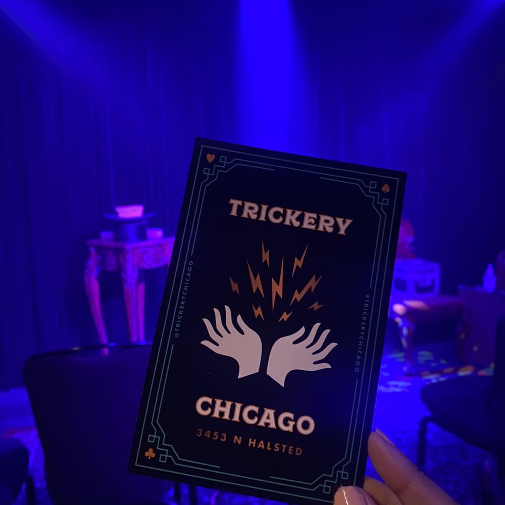 Trickery - a hand holding a trickery chicago book - Performing Arts Near Me - Chicago, Illinois Trickery - a hand holding a trickery chicago book - Performing Arts Near Me - Chicago, Illinois