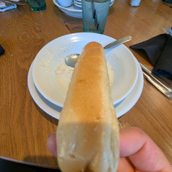 Olive Garden Italian Restaurant - Breadstick going in for a dip - Italian Near Me - Arcadia, California Olive Garden Italian Restaurant - Breadstick going in for a dip - Italian Near Me - Arcadia, California
