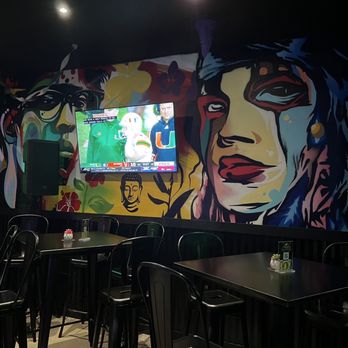 Amigos Beer & Wine Lounge - a mural of a woman's face - Wine Bars Near Me - Margate, Florida Amigos Beer & Wine Lounge - a mural of a woman's face - Wine Bars Near Me - Margate, Florida