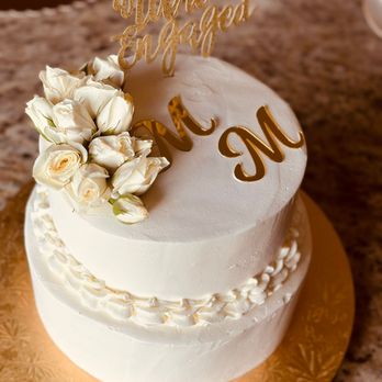 Divine Cakes - a wedding cake with flowers on top - Custom Cakes Near Me - Katy, Texas