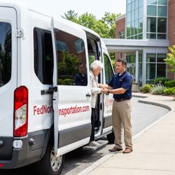 Fednor Transportation - Elderly patient boarding our wheelchair van with driver assistance. Gentle, patient senior transportation in MetroWest MA.