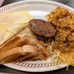 Waffle House - 2 egg breakfast with sausage and topped and smothered hash browns