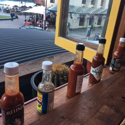 Mexican Tapas Catenna - Hot chilli bottles all in a row.