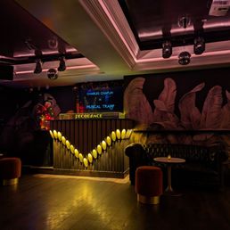 a dark room with a wooden floor a dark room with a wooden floor