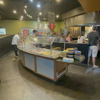 HuHot Mongolian Grill - a group of people in a restaurant - Mongolian Near Me - Rapid City, South Dakota