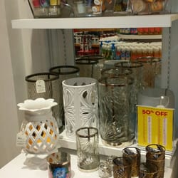 Bath & Body Works - Big selection of large & small candle holders.   Pretty ones and different styles.