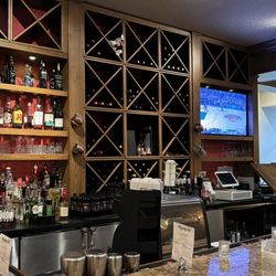 Marigold Bistro - Bar area: Full bar, wine wall, TV in the corner