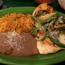 The pollo adobe - tender chicken, tasty cheese sauce, and a nice mix of healthy veggies. Sides of refried beans and rice. Great value! The pollo adobe - tender chicken, tasty cheese sauce, and a nice mix of healthy veggies. Sides of refried beans and rice. Great value!