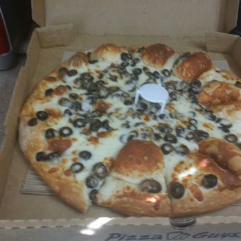 Pizza Guys - Close up of cheese and olives - Pizza Near Me - Sparks, Nevada
