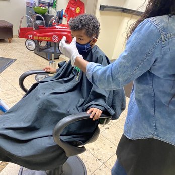 Tangles and Knots - Watching tv while getting hair cut - Hair Salons Near Me - Garland, Texas