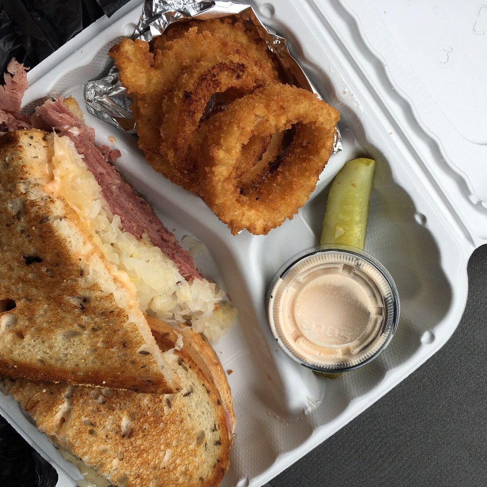 Corned Beef King - Classic Reuben with a side of onion rings - Sandwiches Near Me - Rockville, Maryland
