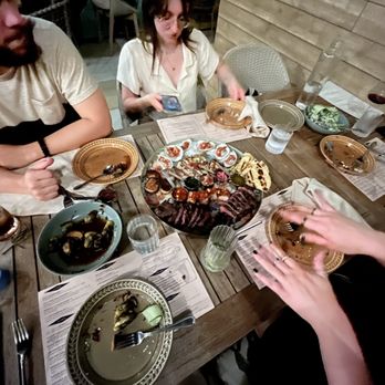 Jaja - Large Seafood / steak plate, cucumber salad, and some of the best friends a man could ask for - Cocktail Bars Near Me - Cleveland, Ohio