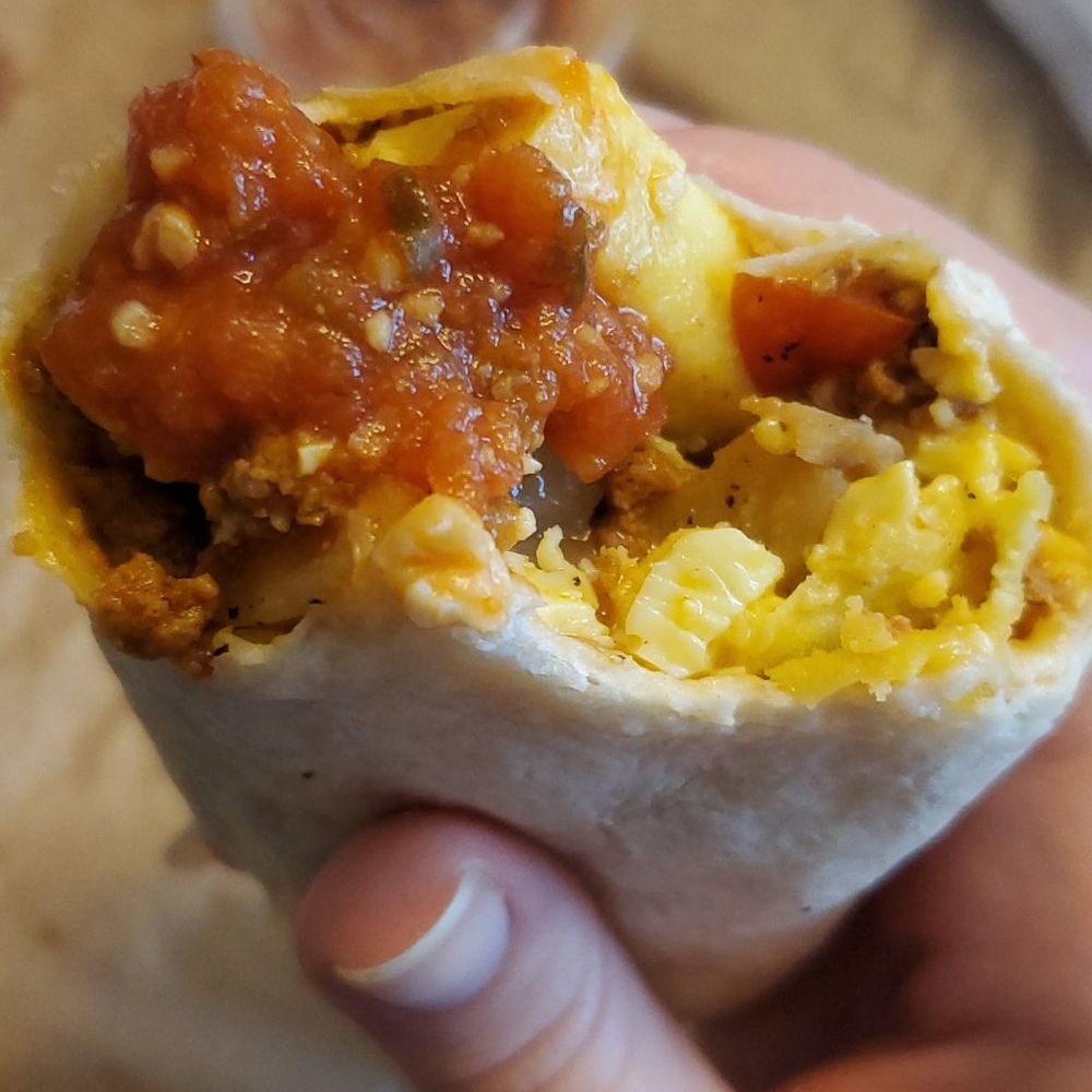 Sunshine Coffee - Inside the burrito - egg, cheese, potato and meat - Coffee & Tea Near Me - Smithville, Missouri Sunshine Coffee - Inside the burrito - egg, cheese, potato and meat - Coffee & Tea Near Me - Smithville, Missouri