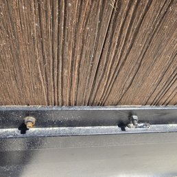 Rusted screws across fence after they were asked to fix the problem. Rusted screws across fence after they were asked to fix the problem.