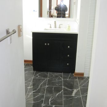 Dede Construction - Porcelain tile floor, vanity, quartz top and faucet  in medium size bathroom - General Contractors Near Me - Phelps, New York