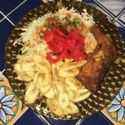 Mi Tierra Restaurant Sabor Catracho - Pollo con tajadas/ fried chicken with plantains with a caggabe salad and our house sauces
