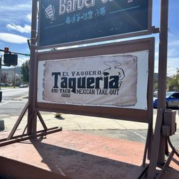 Business sign, patio and store front.