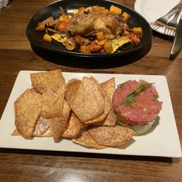Duck confit with mushroom ravioli and tuna tartare with taro chips