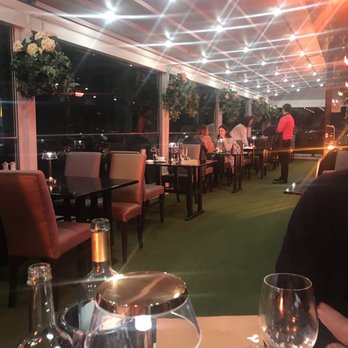 FIRE Steakhouse & Bar - This is the patio... there are heat lamps and it was very warm and cozy... we both took our coats off not cold at all - Brasseries Near Me - Dublin, D