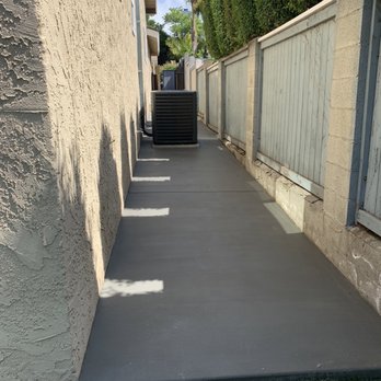 We Do It Custom - Our side of the house after the concrete installation. - General Contractors Near Me