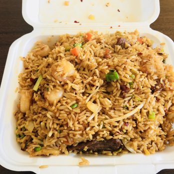 Tang's Express - a close up of a take out container of food - Chinese Near Me - Houston, Texas