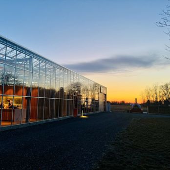 Granor Farm - Granor Farms Greenhouse at sunset for a weekend winter farm dinner - CSA Near Me - Three Oaks, Michigan Granor Farm - Granor Farms Greenhouse at sunset for a weekend winter farm dinner - CSA Near Me - Three Oaks, Michigan
