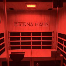 Eterna Haus Longevity Lounge - Full-spectrum infrared sauna with full panel red light therapy at ETERNA HAUS to support detox, skin health, & deep relaxation. Kept at 175°