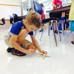 Testing the accuracy of his catapult.