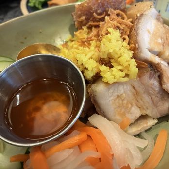 Chao - Crispy roast pork rice with cucumber, pickled carrots and daikon. Rice had a hint of curry seasoning - Asian Fusion Near Me - Honolulu, Hawaii