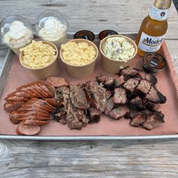 Jalapeño sausage, brisket, burnt ends, mac & cheese, potato salad, and banana pudding