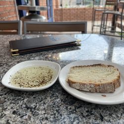 Larkspur Bistro & Bar - Sourdough blend bread and oil with cracked black pepper