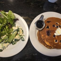 The skinny: Egg whites, spinach, onion, and salad. Plus two blueberry pancakes.