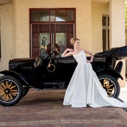 Basque waist wedding dress offered at Sandra D's Bridal Boutique.