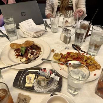 The Capital Grille - Prosciutto-Wrapped Mozzarella with Vine Ripe Tomatoes and Pan-Fried Calamari with Hot Cherry Peppers - Steakhouses Near Me - Jacksonville, Florida