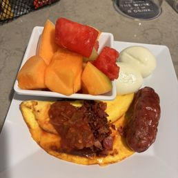 Some of Sunday's breakfast spread - baby omelet with salsa (good), a great Irish banger sausage, boiled eggs, fresh melon.