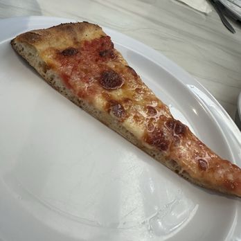 Frank Pepe Pizzeria Napoletana - A slice of the pizza. Crust is a bit thicker than New York style, but the crust, tomato and cheese combination are very good. - Pizza Near Me - Bethesda, Maryland Frank Pepe Pizzeria Napoletana - A slice of the pizza. Crust is a bit thicker than New York style, but the crust, tomato and cheese combination are very good. - Pizza Near Me - Bethesda, Maryland