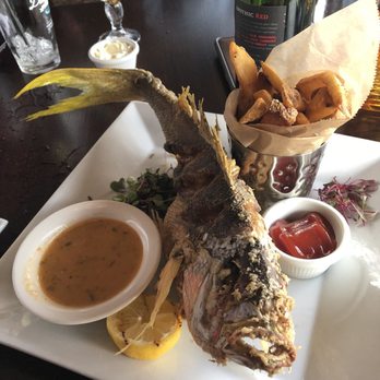 Rusty Pelican - Fried grouper with a side of Brussels Sprout & Steak Fries! Yumm - Seafood Near Me - Tampa, Florida