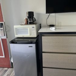 Town & Country Inn - Fridge, microwave, and coffee pot along with drawers.