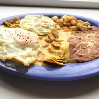 Papa Tacho's - Los Chilaquiles (chee-law-key-less).  Two eggs served on lightly fried corn tortillas strips smothered in green or red Anaheim Pepper sauce. - Mexican Near Me - Midland, Texas