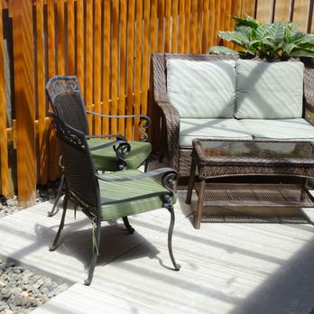 Welton Quality Construction - a patio with two chairs and a table - General Contractors Near Me Welton Quality Construction - a patio with two chairs and a table - General Contractors Near Me