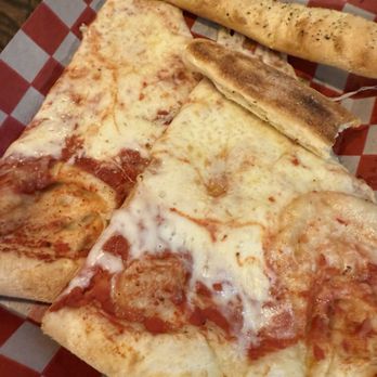 Goodfellas Pizzeria - Cheese slices after pouring grease off - Pizza Near Me - Bloomington, Indiana Goodfellas Pizzeria - Cheese slices after pouring grease off - Pizza Near Me - Bloomington, Indiana