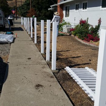 Francisco's  Landscaping -  white picketer and a car parked on the side of the road - Landscaping Near Me - Concord, California